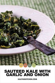 cooked kale with garlic and onion in a white bowl on a green tablecloth