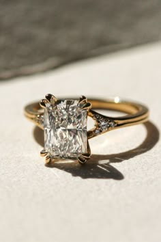 an engagement ring with a princess cut diamond