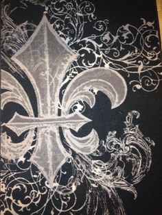 a black and white drawing of a fleur de lis on a piece of paper