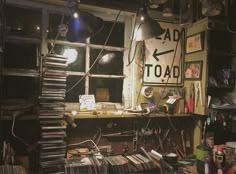 a room filled with lots of clutter next to a window