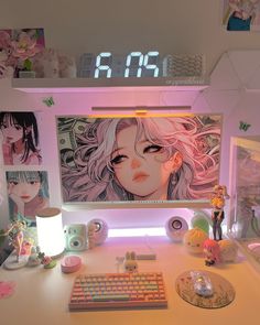 a white desk topped with a computer keyboard and monitor next to a clock on the wall