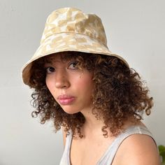 Perfect for a day of fun in the sun, our bucket hat is structured with an extra-wide brim to keep you cool and covered on the go. 100% cotton canvas screen printed with water-based inks Made in California Brim: 3.5" Circumference: 23" To clean: spot clean and/or dry clean. Trendy Cotton Sun Hat With Flat Brim, Summer Cotton Sun Hat With Flat Brim, Cotton Bucket Hat With Curved Brim For Beach, Reversible Cotton Bucket Hat With Short Brim, Summer Cotton Bucket Hat With Flat Brim, Cotton Reversible Bucket Hat With Short Brim, Adjustable Brimmed Canvas Sun Hat, Everyday Cotton Sun Hat With Curved Brim, Adjustable Canvas Bucket Hat With Flat Brim