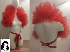 a mannequin head with red hair on it's face and an orange ribbon around the neck