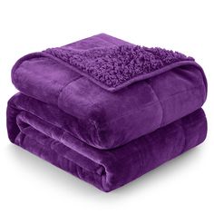 two purple blankets stacked on top of each other