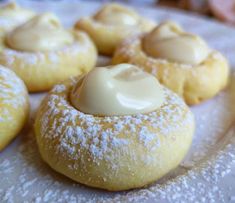 powdered doughnuts with icing on a plate