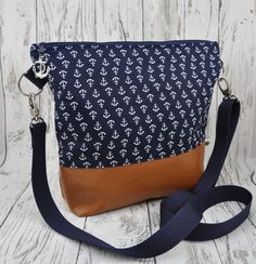 a purse with an anchor pattern on it