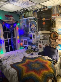 a bedroom decorated for christmas with lights and pictures on the wall above the bedspread