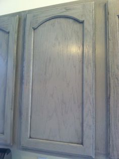 an unfinished kitchen cabinet with white paint