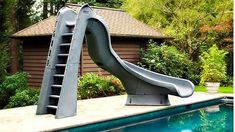 a water slide next to a swimming pool