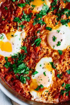 an egg and tomato pizza with parsley on top