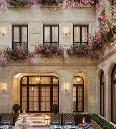 an elegant courtyard with potted plants and flowers