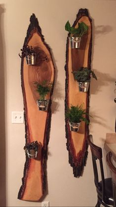 two wooden shelves with plants and pots on them