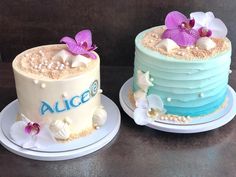 two cakes decorated with flowers and seashells on plates