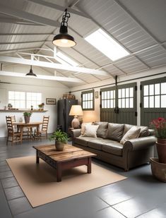 a living room filled with furniture and lots of windows