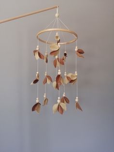 a wind chime with leaves hanging from it