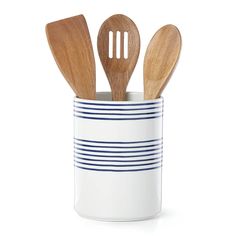 three wooden utensils in a white and blue striped cup with spoons inside