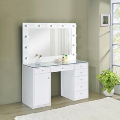 a white vanity with lights on it in a room