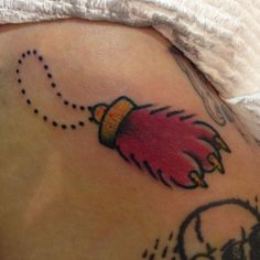 a close up of a person's stomach with tattoos on it and an image of a bird