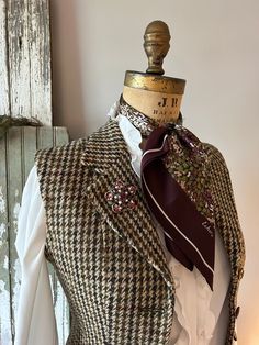 "A fitted, wool tweed vest for your winter wardrobe. This was once a houndstooth blazer and now has been altered into a vest/waistcoat. It is a 1970's Harris Tweed. I was delighted to come across this.  Wear this to dress up or down, it doesn't matter. It's one of a kind, altered by me, into a timeless piece that's a little bit more versatile than the blazer jacket it once was.  - Vintage by Civity Clothes, using a Harris Tweed. Probably 1980's or '90's. Made in England. - 100% wool tweed. - The Luxury Houndstooth Tweed Jacket For Tailoring, Luxury Houndstooth Tweed Jacket For Spring, Luxury Vintage Tweed Jacket For Formal Occasions, Luxury Vintage Fitted Tweed Jacket, Luxury Wool Tweed Workwear Dress, Winter Gucci Tweed Jacket, Luxury Vintage Houndstooth Tweed Jacket, Luxury Tweed Houndstooth Outerwear, Luxury Houndstooth Tweed Jacket For Fall