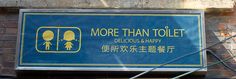 a sign on the side of a building that says more than toilet delicious and happy