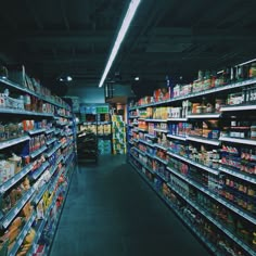 an aisle in a grocery store filled with lots of food