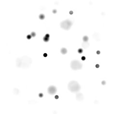 black and white dots are flying in the air on a white background that appears to be blurry