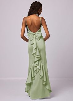 the back of a woman in a green dress