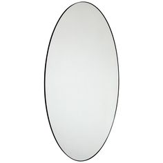 an oval mirror on a white wall with black trimmings and a single line around the edge