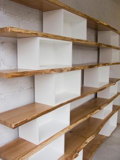 the shelves are lined up against the wall