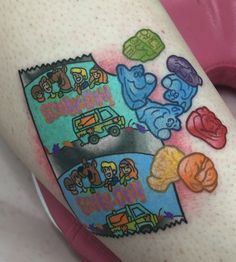 this is an image of someone's thigh with cartoon tattoos on it and the words happy birthday