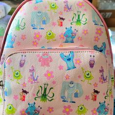 Super Awesome Danielle Nicole Disney Monsters Inc. Great Backpack Design. Exclusive And Hard To Find. This Is A Fun Summertime Bag. It Has A Large Zipper Compartment And A Smaller Zipper Compartment On The Front With Adjustable Leather Straps. Great For Everyday Use. Disney Style Backpack For School, Pink Disney Bag For Daily Use, Cute Multicolor Backpack For Disney Trips, Pink Disney Backpack For Fan Events, Pink Disney Backpack For Disney Fan Events, Playful Pink Backpack, Playful Pink Standard Backpack, Pink Backpack For Disney Trips With Zipper Closure, Cute Bags For Disney Trips