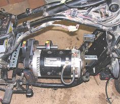 an image of the inside of a vehicle with wires and other parts attached to it