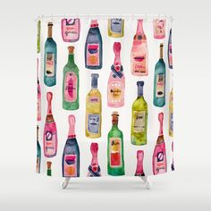 a shower curtain with many different bottles on it