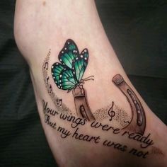 a foot with a butterfly and horseshoes on it that says, you wings are ready but my heart was not