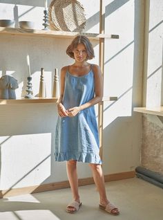 "PRODUCED in 3-5 days FAST & FREE shipping with DHL Express Courier -10% for all items with code \"FAVOURITE\" Made from prewashed soft linen in a steel blue hue, this ruffled hem dress is a great companion on warm summer days. You can also wear it as a night dress. For a more rebellious look, style it with a biker jacket and feel exceptional! - 100% Linen - Pure linen fabric - Round neck - Adjustable straps - Simple A-line shape - Above-knee length - Ruffled hem - Comfortable fit - Model's height is 160 cm / 5'3'' wears size M - Code: E9003-L532-126   The dress is available in other colors. You can find them in the gallery. If you want to order the dress in another color, please specify it in the personalization field. Sizing: This garment is true to size, and we recommend choosing the si Sleeveless Blue Linen Summer Dress, Elegant Blue Knee-length Linen Dress, Sleeveless Blue Linen Mini Dress, Washed Blue Cotton Knee-length Dress, Relaxed Fit Blue Linen Knee-length Dress, Blue Linen Dress, Linen Mini Dress, Linen Short, Ruffle Hem Dress