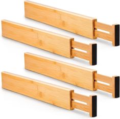 three pieces of wood with black handles on each side