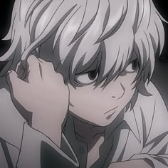 an anime character with white hair and black eyes, holding his hand to his face