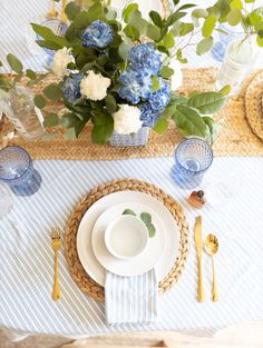 a place setting with blue and white flowers