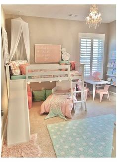 a child's bedroom with bunk beds, rugs and other furniture in it