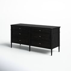 a black dresser sitting on top of a white floor