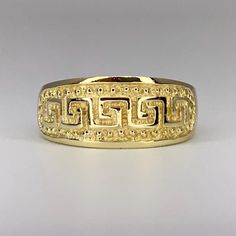 Classic 10K solid yellow gold Greek Key design textured ring! This simple yet elegant ring is a size 7. The band measures approximately 8mm wide at the front and gradually tapers to 3mm at the back of the band for comfortable wear. The exterior is highly polished with textured, dimensional Greek Key design across the front of the band. The inside is stamped for "10K" gold. This ring will arrive in gift packaging and secure domestic shipping with insurance is included at no additional charge. Int Mc Donald, Textured Ring, Key Design, Greek Key, Elegant Ring, Ring Band, Texture Design, Solid Yellow, 10k Gold