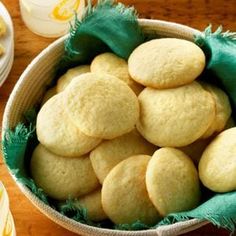 a bowl filled with cookies on top of a wooden table