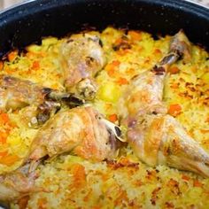 chicken and rice casserole with carrots in a pan