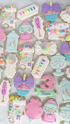 some decorated cookies are laying on a table