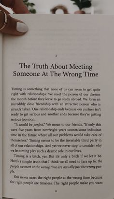 someone holding an open book in their hand with the text'the truth about meeting someone at the wrong time '