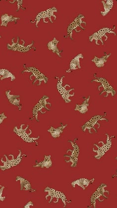 a red background with gold leopards on it