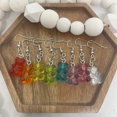 Who doesn't love a cute and colorful gummy bear? These handmade earrings are inspired by the classic candy, featuring miniature gummy bear charms in vibrant, cheerful colors. Whether you're a candy lover, a fan of fun accessories, or just want to add a little whimsy to your look, these earrings are sure to make a statement. Each pair is carefully handcrafted to capture the sweet essence of your favorite gummy bear treats, making them a delightful, one-of-a-kind accessory for everyday wear, festivals, or even as a cute gift for someone special! Perfect for anyone who loves a playful, nostalgic touch in their jewelry collection! These gummy bear earrings are sure to bring a smile to your face and a splash of fun to your outfit. 🐻✨ Treat yourself or a friend to a pair today and add some suga Gummy Earrings, Gummy Bear Earrings Outfit, Gummy Bear Necklace Beads, Gummy Bears Earrings, Dangly Gummy Bear Earrings Betsey Johnson, Classic Candy, Gummy Bears, Handmade Earrings, Cute Gifts