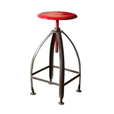 a red stool sitting on top of a metal frame