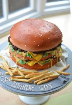 a birthday cake made to look like a hamburger and fries