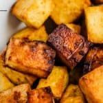 there is a bowl full of tofu cubes that are cooked and ready to be eaten